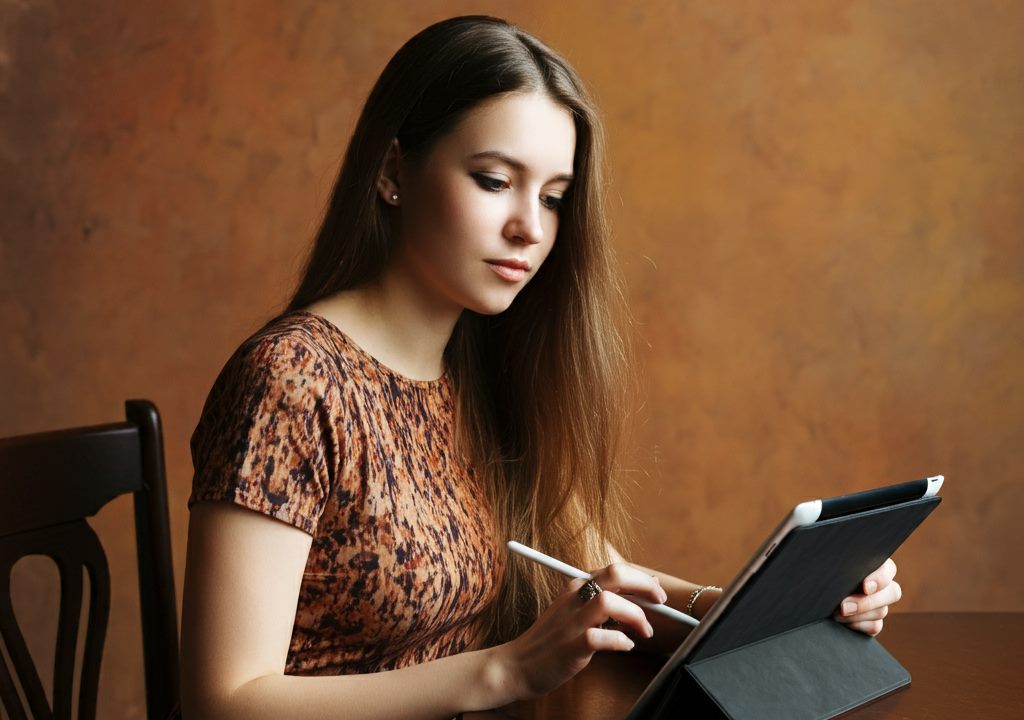 a woman using tablet computer